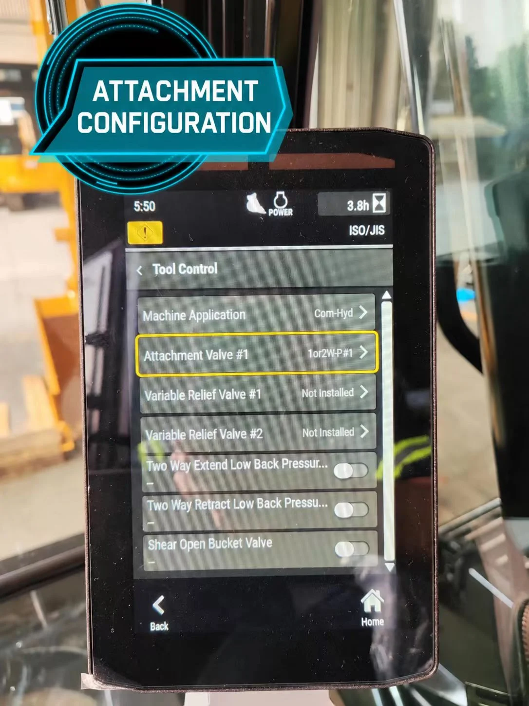Excavator Tool Control monitor with the Attachment Valve setting highlighted.