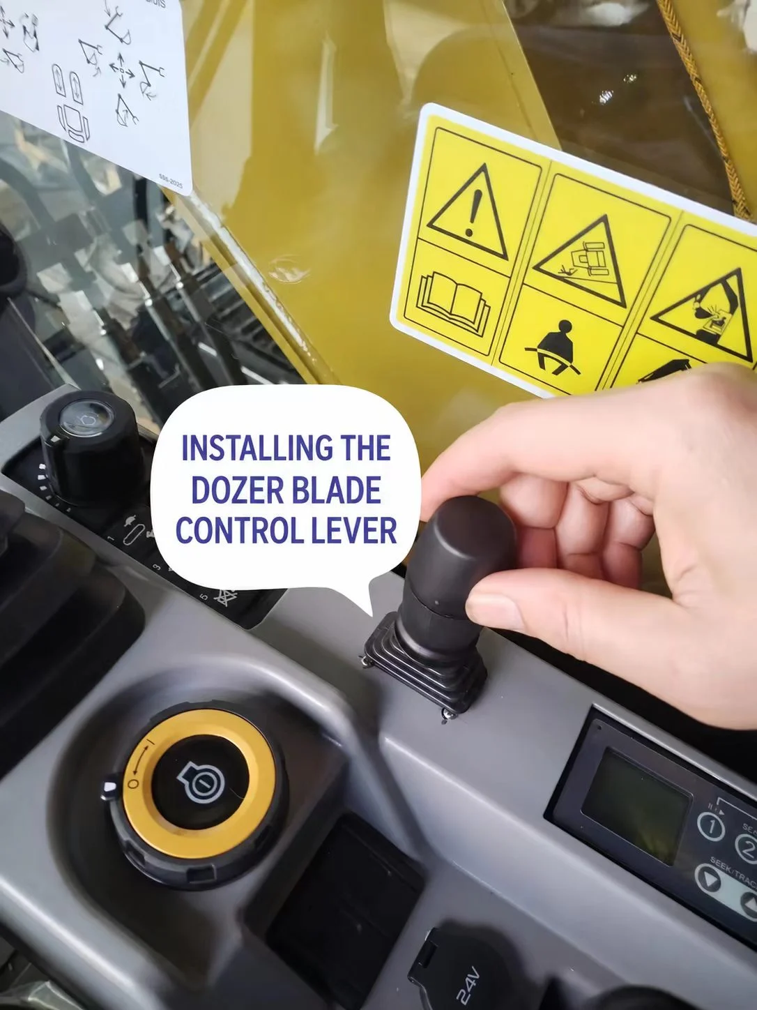 Blade control lever being fitted in the CAT 313 GC cab console.