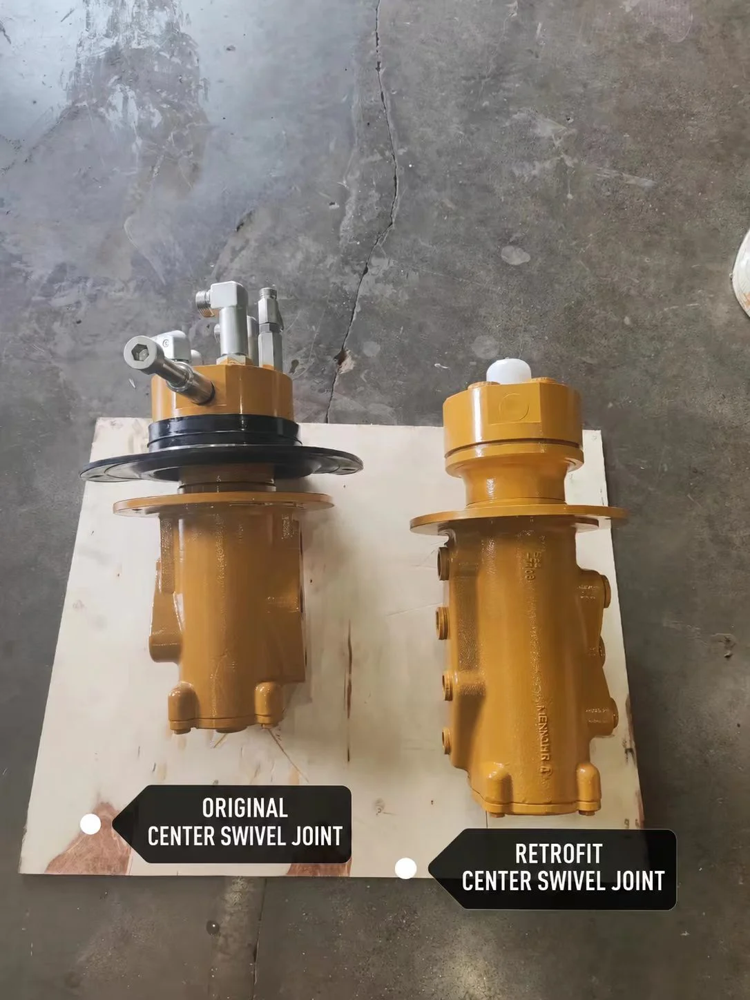 Original and retrofit center swivel joints placed side by side on a board.